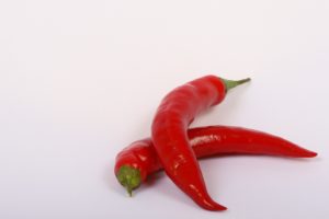 Two red, hot peppers